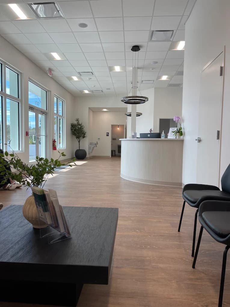 The reception desk and waiting area at St. Pete Family & Cosmetic Dentistry.