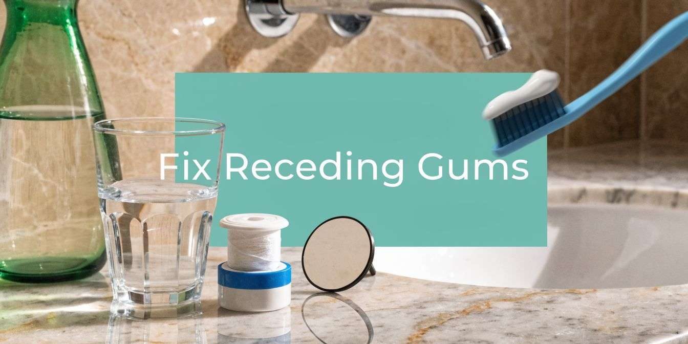 how-to-fix-receding-gums-dental-care Banner with the words 'Fix Receding Gums' over a teal background in a bathroom; toothbrush, glass of water, and dental floss on a marble sink counter behind it